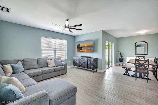 692 Hadley St E, Naples, FL 34104 - living room featuring a ceiling fan and light wood-type flooring