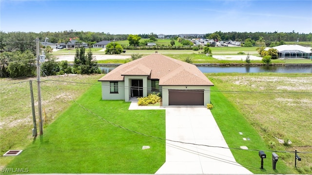 2622 SW 5th St, Cape Coral, FL 33991 - view of front of home with an attached garage, a water view, driveway, and stucco siding