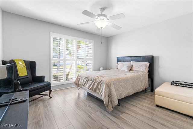 9761 Maplecrest Cir, Lehigh Acres, FL 33936 - bedroom with wood finished floors and a ceiling fan