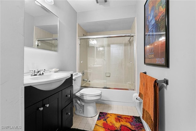 9761 Maplecrest Cir, Lehigh Acres, FL 33936 - bathroom featuring tile patterned floors, vanity, and shower / bath combination with glass door