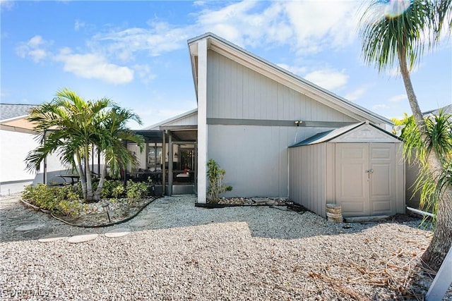 9761 Maplecrest Cir, Lehigh Acres, FL 33936 - view of side of home with a storage shed
