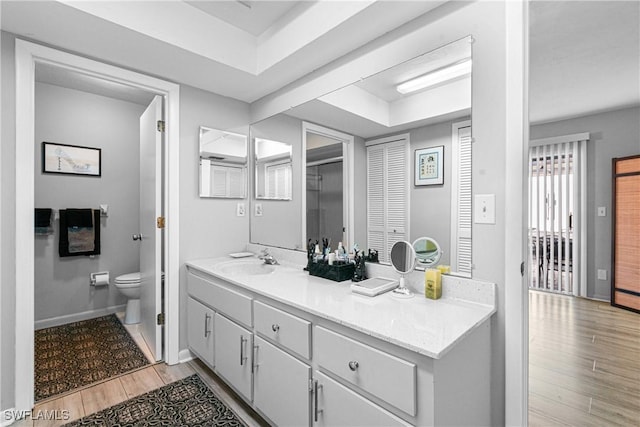 9761 Maplecrest Cir, Lehigh Acres, FL 33936 - full bath featuring wood finished floors and vanity