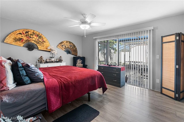 9761 Maplecrest Cir, Lehigh Acres, FL 33936 - bedroom with access to exterior, wood finished floors, and ceiling fan