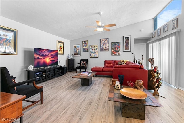 9761 Maplecrest Cir, Lehigh Acres, FL 33936 - living area with lofted ceiling, a ceiling fan, and light wood-style floors
