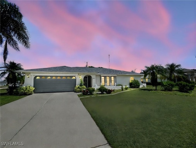 625 SE 35th Ter, Cape Coral, FL 33904 - ranch-style house with driveway, a garage, a yard, and stucco siding
