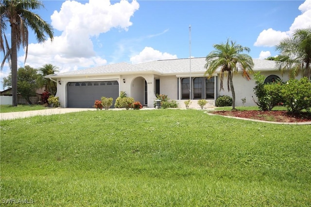 625 SE 35th Ter, Cape Coral, FL 33904 - ranch-style house with stucco siding, a garage, a front lawn, and driveway