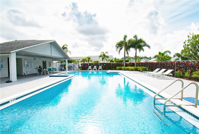 9817 Maplecrest Cir, Lehigh Acres, FL 33936 - community pool with a patio