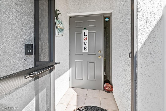 9817 Maplecrest Cir, Lehigh Acres, FL 33936 - property entrance featuring stucco siding