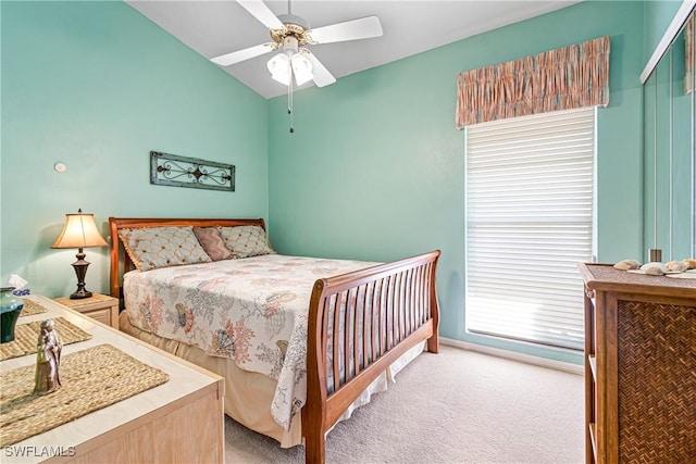 9817 Maplecrest Cir, Lehigh Acres, FL 33936 - bedroom featuring lofted ceiling, light colored carpet, and a ceiling fan