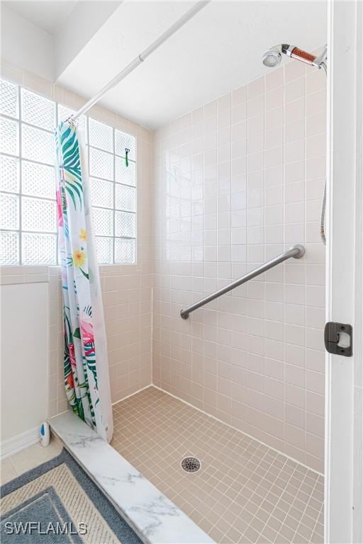9817 Maplecrest Cir, Lehigh Acres, FL 33936 - full bathroom with a shower stall and tile patterned floors