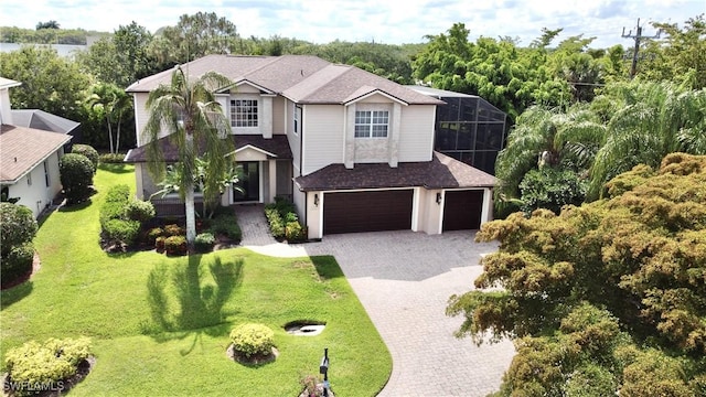 2855 Coach House Way, Naples, FL 34105 - view of front facade featuring decorative driveway, a garage, a shingled roof, and a front lawn