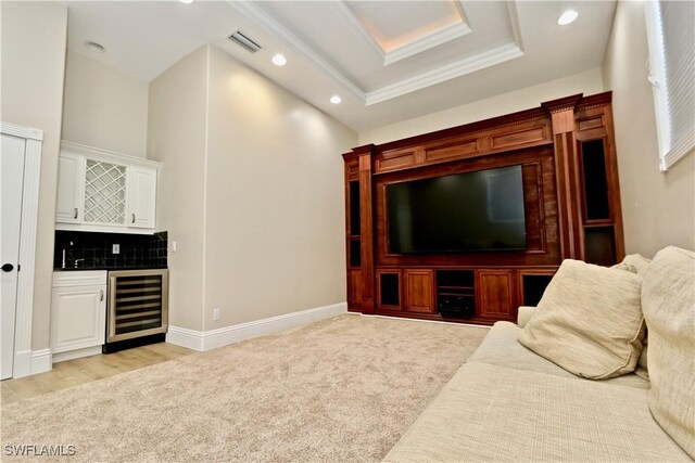 2855 Coach House Way, Naples, FL 34105 - living area featuring wine cooler, a dry bar, recessed lighting, light carpet, and crown molding