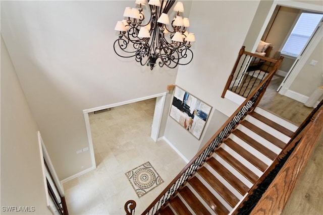 2855 Coach House Way, Naples, FL 34105 - stairs with a chandelier and baseboards