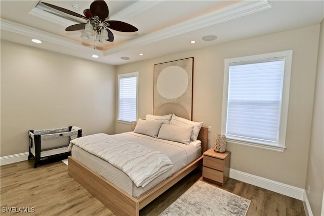 2855 Coach House Way, Naples, FL 34105 - bedroom featuring a tray ceiling, light wood-style floors, crown molding, recessed lighting, and a ceiling fan