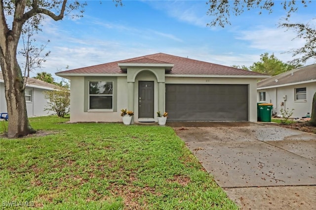 851 102nd Ave N, Naples, FL 34108 - view of front of home with stucco siding, driveway, a shingled roof, and an attached garage