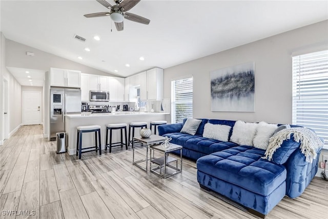 851 102nd Ave N, Naples, FL 34108 - living room with light wood-type flooring, vaulted ceiling, ceiling fan, and recessed lighting