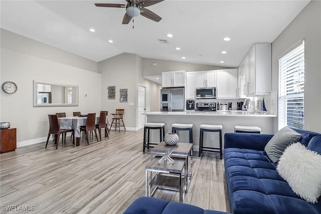 851 102nd Ave N, Naples, FL 34108 - living area featuring ceiling fan, light wood finished floors, recessed lighting, and high vaulted ceiling