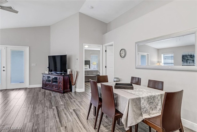 851 102nd Ave N, Naples, FL 34108 - dining room featuring wood finished floors and high vaulted ceiling