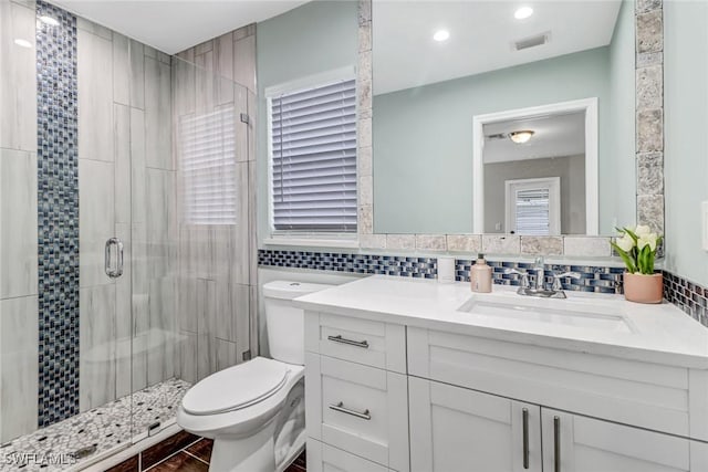851 102nd Ave N, Naples, FL 34108 - bathroom featuring a stall shower, vanity, decorative backsplash, tile walls, and recessed lighting