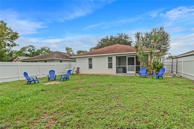 851 102nd Ave N, Naples, FL 34108 - rear view of property featuring a fenced backyard, stucco siding, and a sunroom
