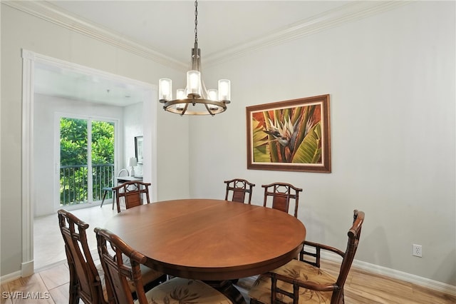 700 L Ambiance Cir Unit 202, Naples, FL 34108 - dining room with a chandelier and crown molding