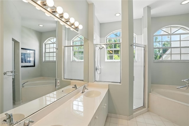 700 L Ambiance Cir Unit 202, Naples, FL 34108 - full bath with a bath, healthy amount of natural light, double vanity, tile patterned flooring, and recessed lighting