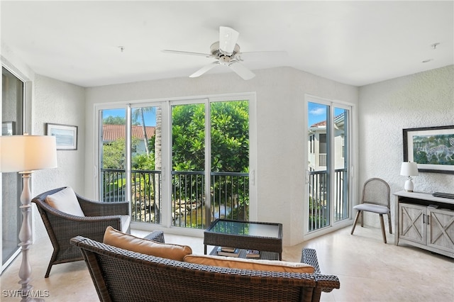 700 L Ambiance Cir Unit 202, Naples, FL 34108 - living area featuring a textured wall and a ceiling fan