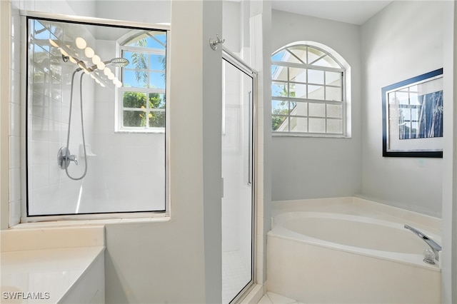 700 L Ambiance Cir Unit 202, Naples, FL 34108 - full bathroom with a shower stall and a garden tub