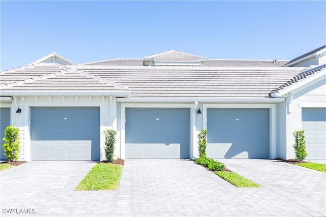 5467 Double Eagle Cir Unit 3212, Ave Maria, FL 34142 - view of front of home with a tile roof and stucco siding