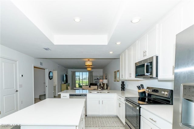 5467 Double Eagle Cir Unit 3212, Ave Maria, FL 34142 - kitchen with appliances with stainless steel finishes, a peninsula, a center island, recessed lighting, and light countertops