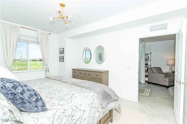 5467 Double Eagle Cir Unit 3212, Ave Maria, FL 34142 - bedroom featuring a chandelier and light tile patterned flooring