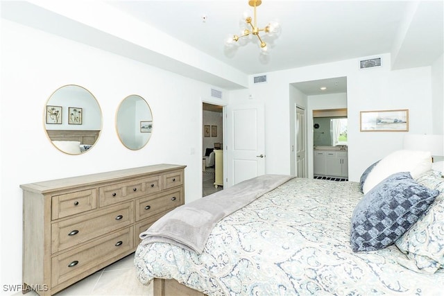 5467 Double Eagle Cir Unit 3212, Ave Maria, FL 34142 - bedroom with a chandelier and ensuite bath