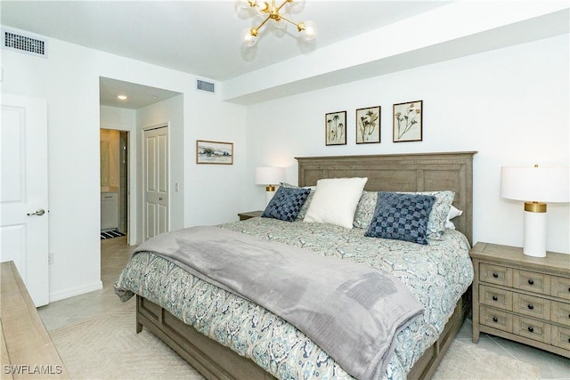 5467 Double Eagle Cir Unit 3212, Ave Maria, FL 34142 - tiled bedroom featuring a closet and a chandelier