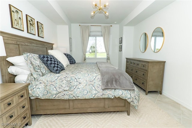 5467 Double Eagle Cir Unit 3212, Ave Maria, FL 34142 - bedroom with a chandelier and light tile patterned floors