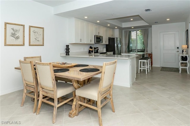 5467 Double Eagle Cir Unit 3212, Ave Maria, FL 34142 - dining space featuring light tile patterned flooring and recessed lighting