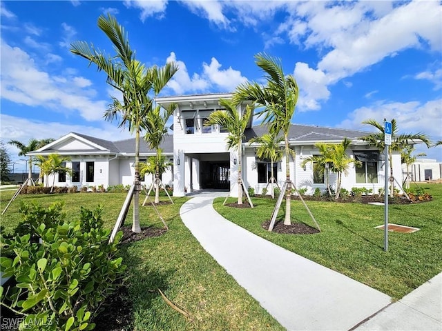 5467 Double Eagle Cir Unit 3212, Ave Maria, FL 34142 - view of front of house featuring a carport, driveway, and a front yard