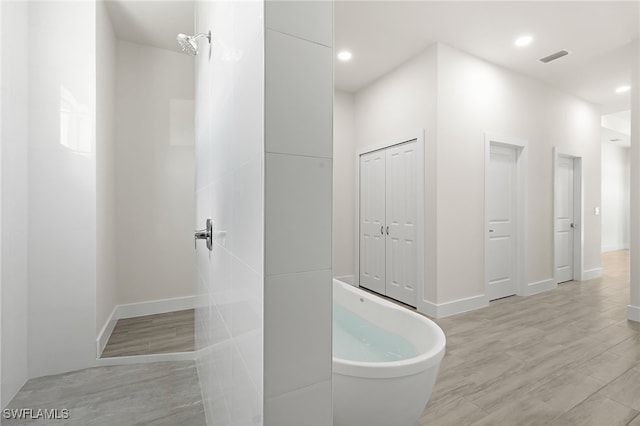 1159 SW 5th Ter, Cape Coral, FL 33991 - full bathroom featuring a freestanding tub and recessed lighting