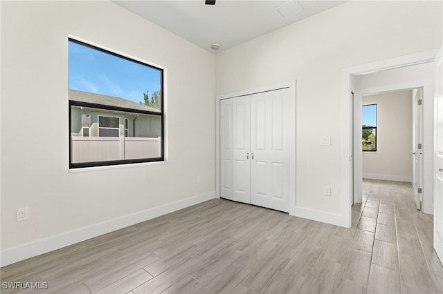 1159 SW 5th Ter, Cape Coral, FL 33991 - unfurnished bedroom featuring wood finished floors, a closet, and a ceiling fan