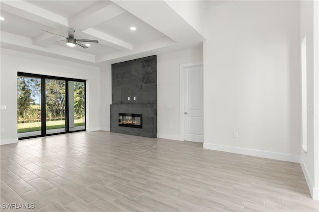 1159 SW 5th Ter, Cape Coral, FL 33991 - unfurnished living room featuring ceiling fan, recessed lighting, beam ceiling, a tiled fireplace, and coffered ceiling
