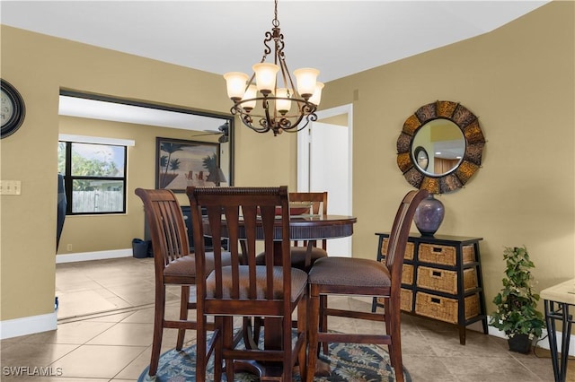 27780 Matheson Ave, Bonita Springs, FL 34135 - dining space with a chandelier, tile patterned floors, and a ceiling fan