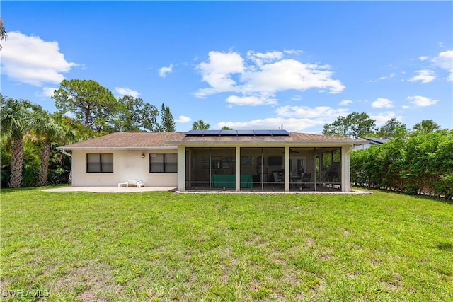 27780 Matheson Ave, Bonita Springs, FL 34135 - back of property featuring solar panels, a sunroom, a yard, stucco siding, and a patio area