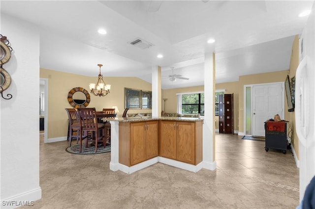 27780 Matheson Ave, Bonita Springs, FL 34135 - kitchen featuring ceiling fan, light stone counters, recessed lighting, pendant lighting, and a chandelier