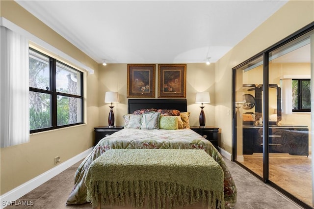 27780 Matheson Ave, Bonita Springs, FL 34135 - bedroom featuring multiple windows and dark tile patterned floors