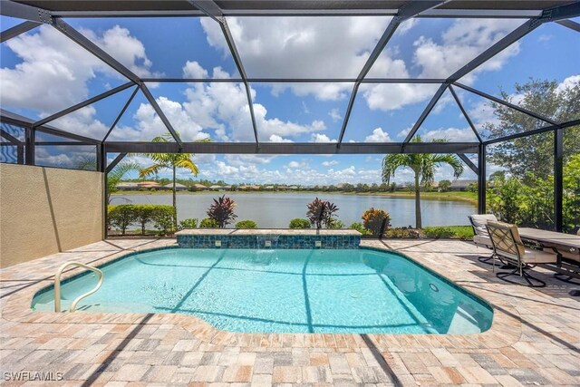 7773 Jacaranda Ln, Naples, FL 34114 - outdoor pool featuring a water view, a patio, and a lanai