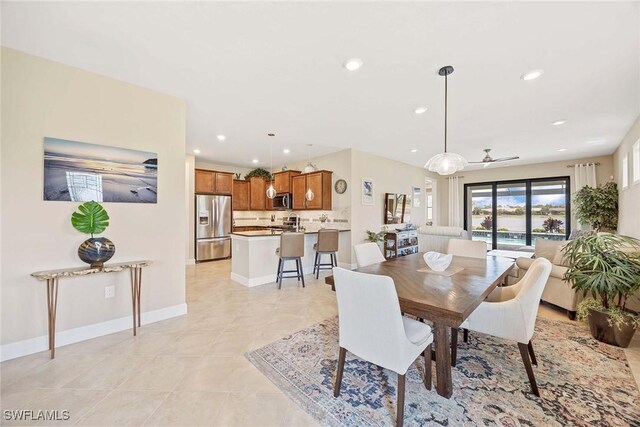 7773 Jacaranda Ln, Naples, FL 34114 - dining space featuring recessed lighting and light tile patterned floors