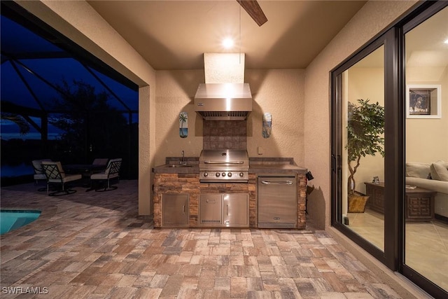 7773 Jacaranda Ln, Naples, FL 34114 - view of patio with an outdoor kitchen and a sink