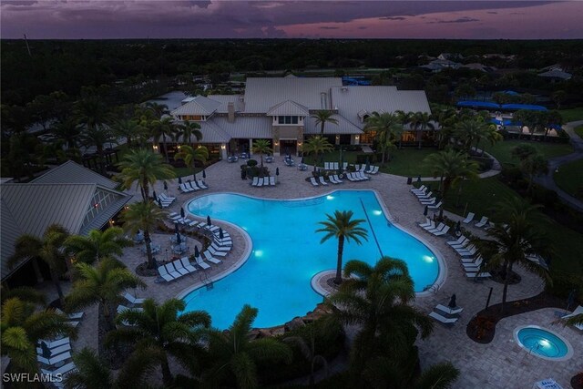 7773 Jacaranda Ln, Naples, FL 34114 - community pool featuring a patio area