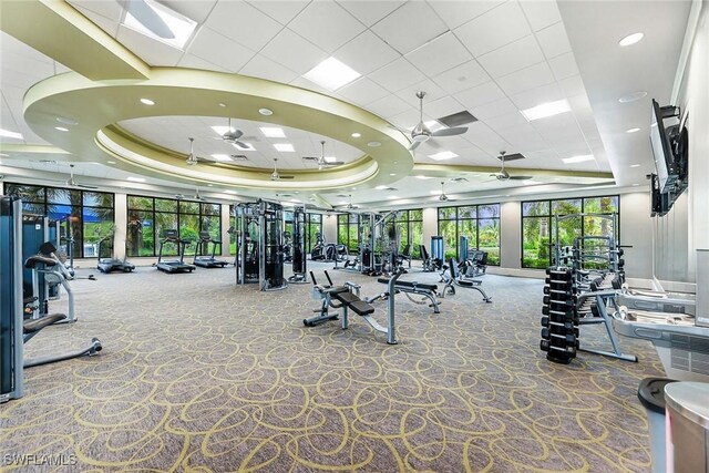 7773 Jacaranda Ln, Naples, FL 34114 - workout area with a raised ceiling, a ceiling fan, carpet flooring, and recessed lighting