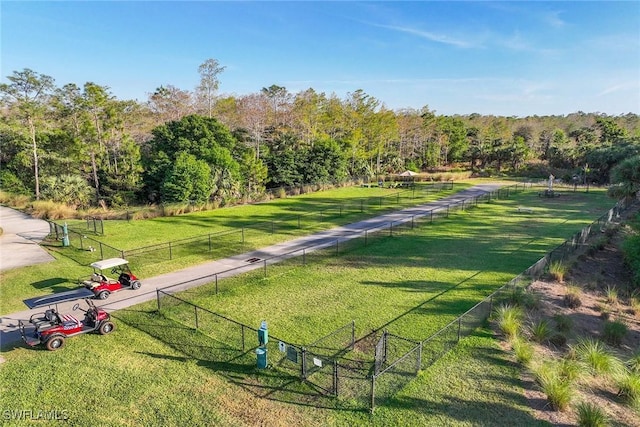 7773 Jacaranda Ln, Naples, FL 34114 - view of property's community featuring a view of trees