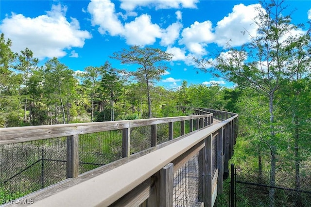 7773 Jacaranda Ln, Naples, FL 34114 - balcony with a wooded view